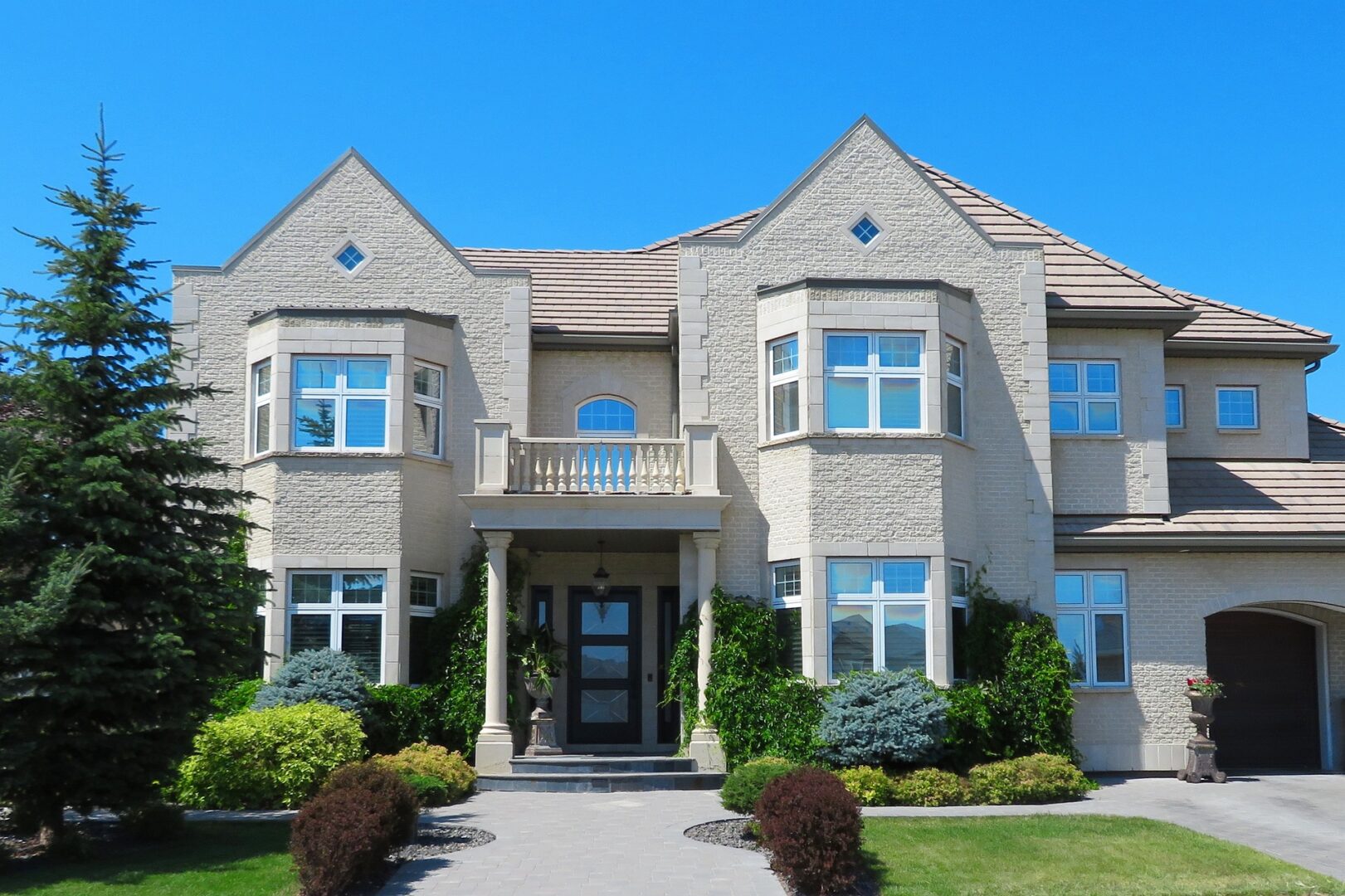 A large house with many windows and doors.